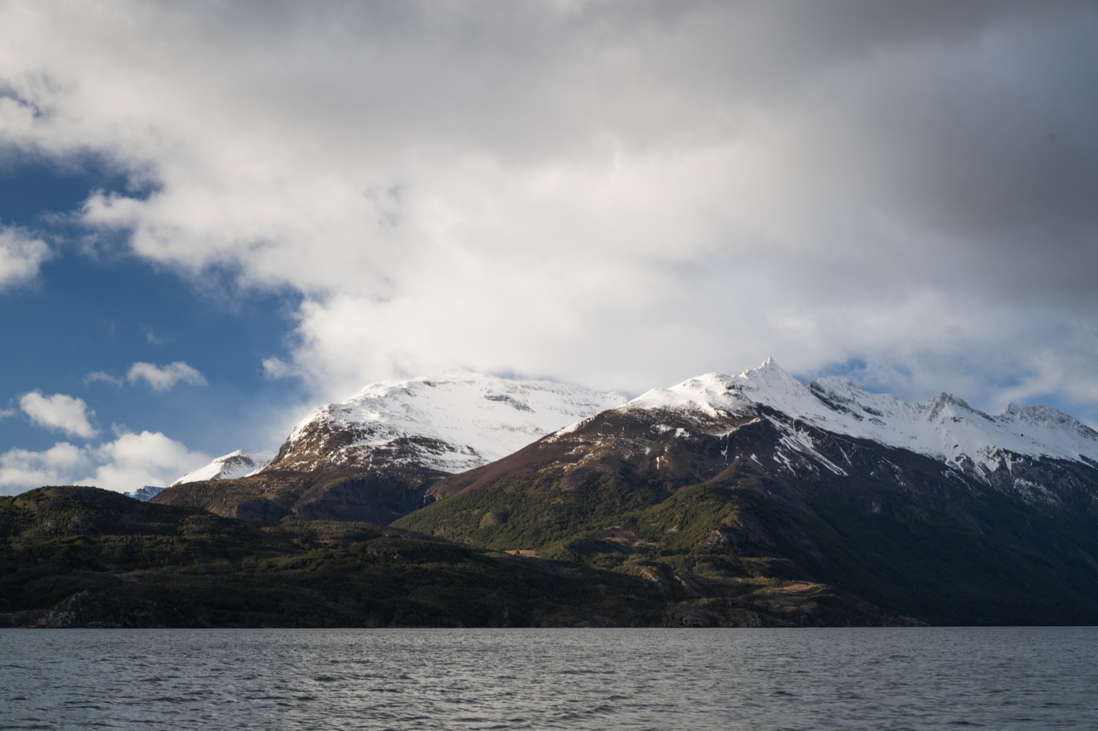 The Balmaceda hanging glacier descending to the Última Esperanza fjord with floating ice