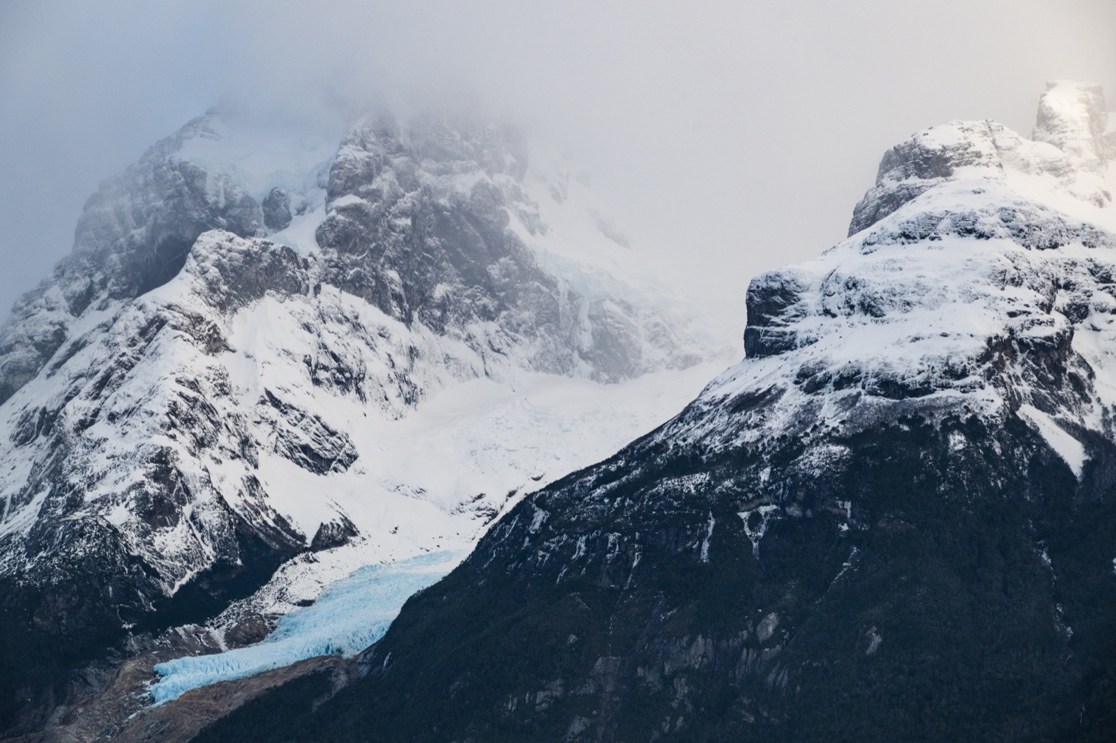 The Balmaceda hanging glacier descending to the Última Esperanza fjord with floating ice